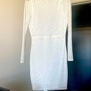 Fitted White sequins dress with sheer sleeves. Low back with zipper.